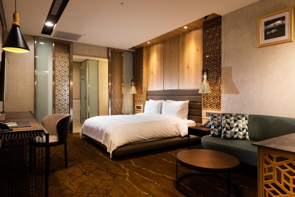 Postel nebo postele na pokoji v ubytování Hotel Château Anping