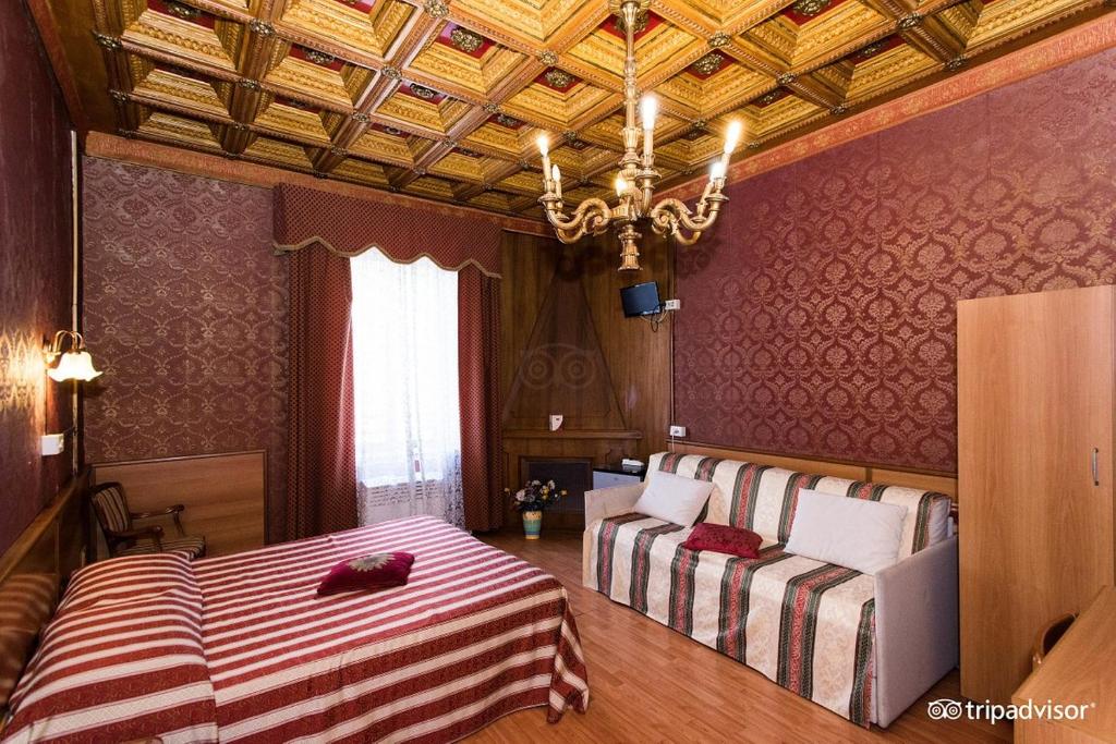 Postel nebo postele na pokoji v ubytování Hotel Artromano