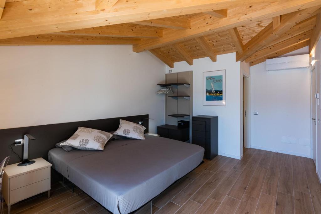 Postel nebo postele na pokoji v ubytování Foresteria Lago di Como