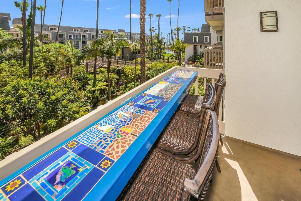 a water slide on a balcony with a pool at G218 - Palms Away in Oceanside