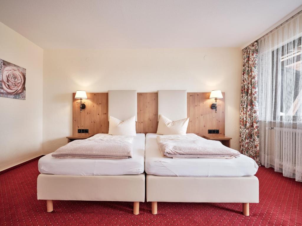 Postel nebo postele na pokoji v ubytování Hotel Hochfirst