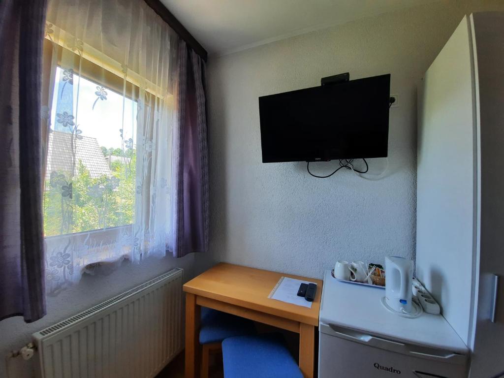 Televízia a/alebo spoločenská miestnosť v ubytovaní Guest House Matej & Mateja