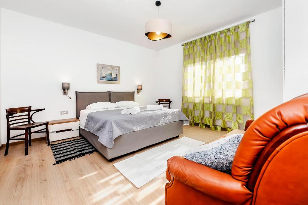 Postel nebo postele na pokoji v ubytování Apartments El Corsaro