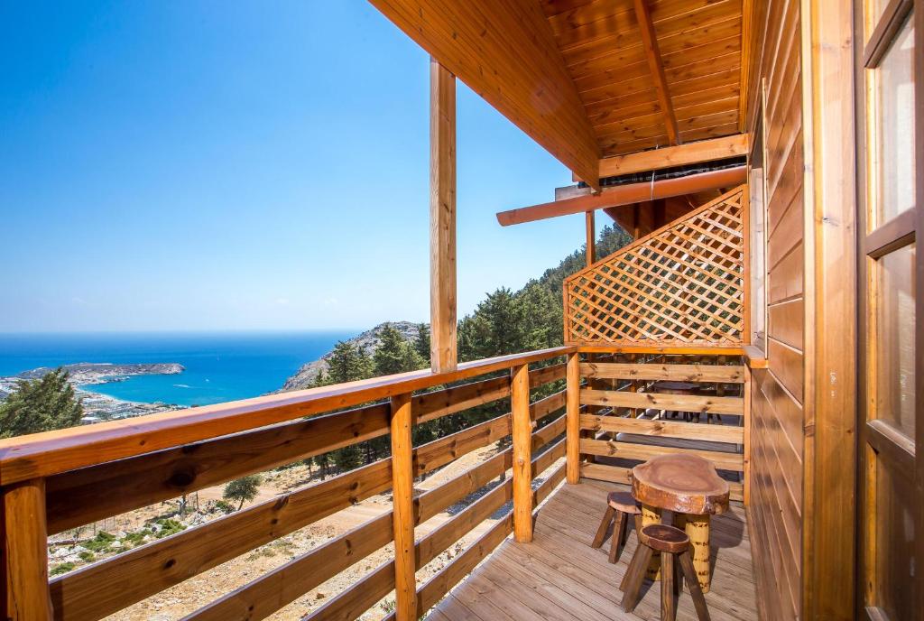 a balcony with a view of the ocean at Apartments Costa Hilltop, Rhodes in Kolimbia