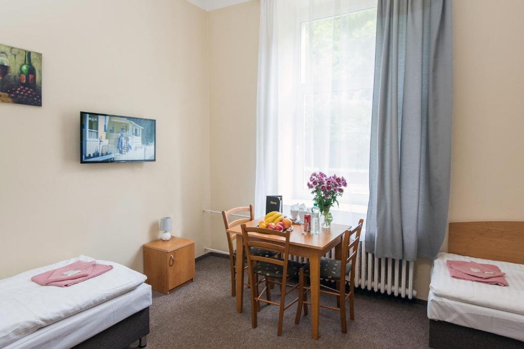 Postel nebo postele na pokoji v ubytování Hotel Hůrka