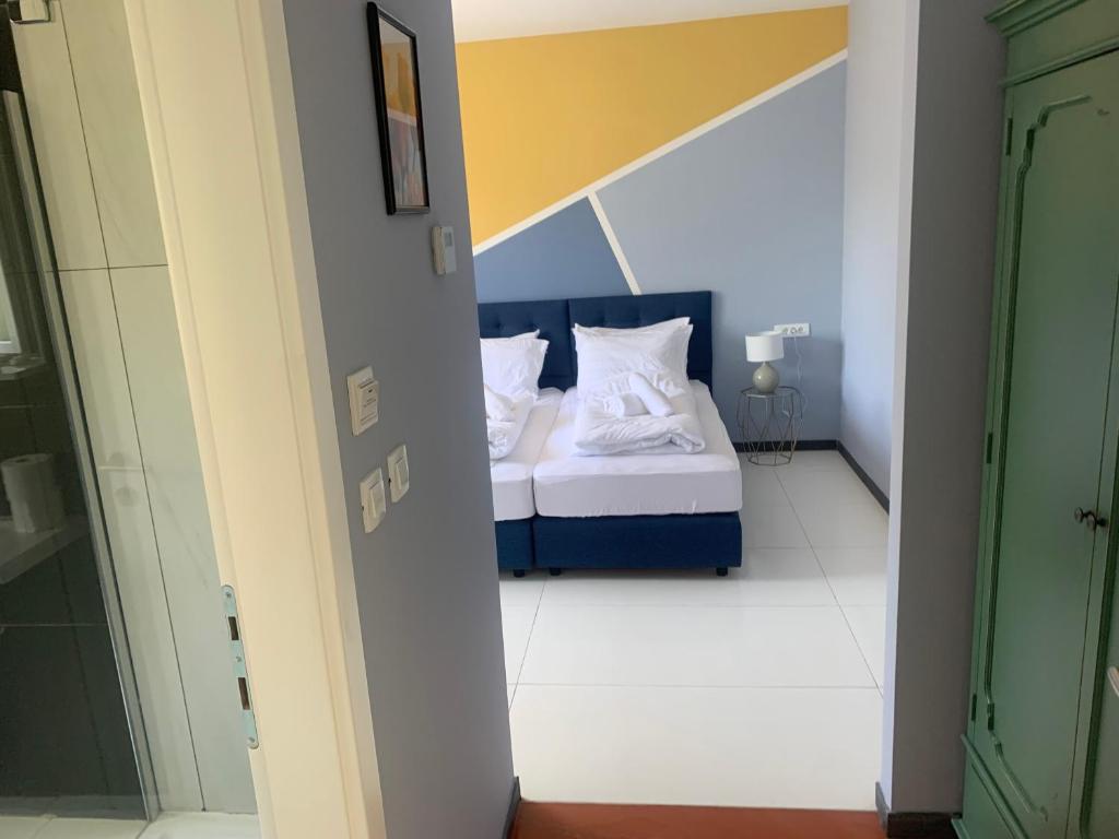 Posteľ alebo postele v izbe v ubytovaní Hotel Elu Iris
