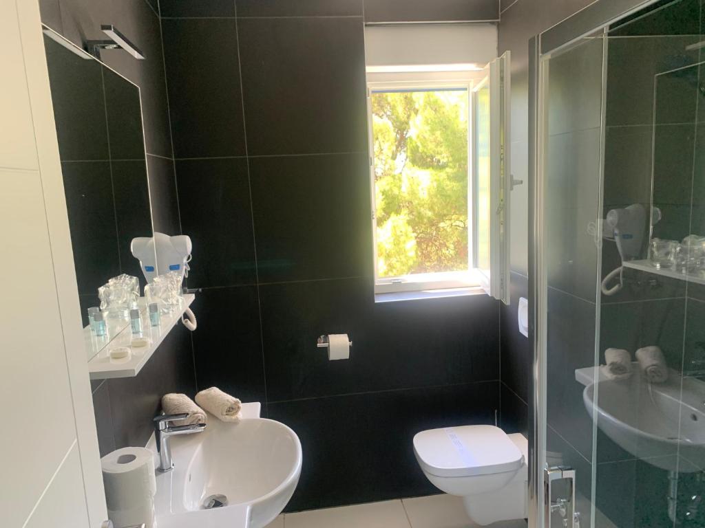 Kúpeľňa v ubytovaní Hotel Elu Iris