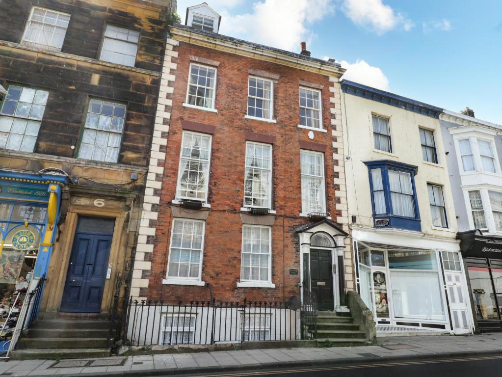 a brick building on the side of a street at Regent House in Scarborough