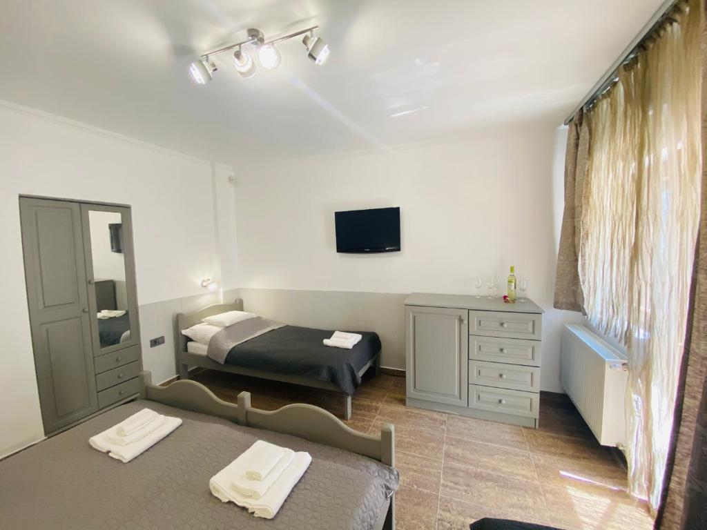 Postel nebo postele na pokoji v ubytování Linton Apartmanház