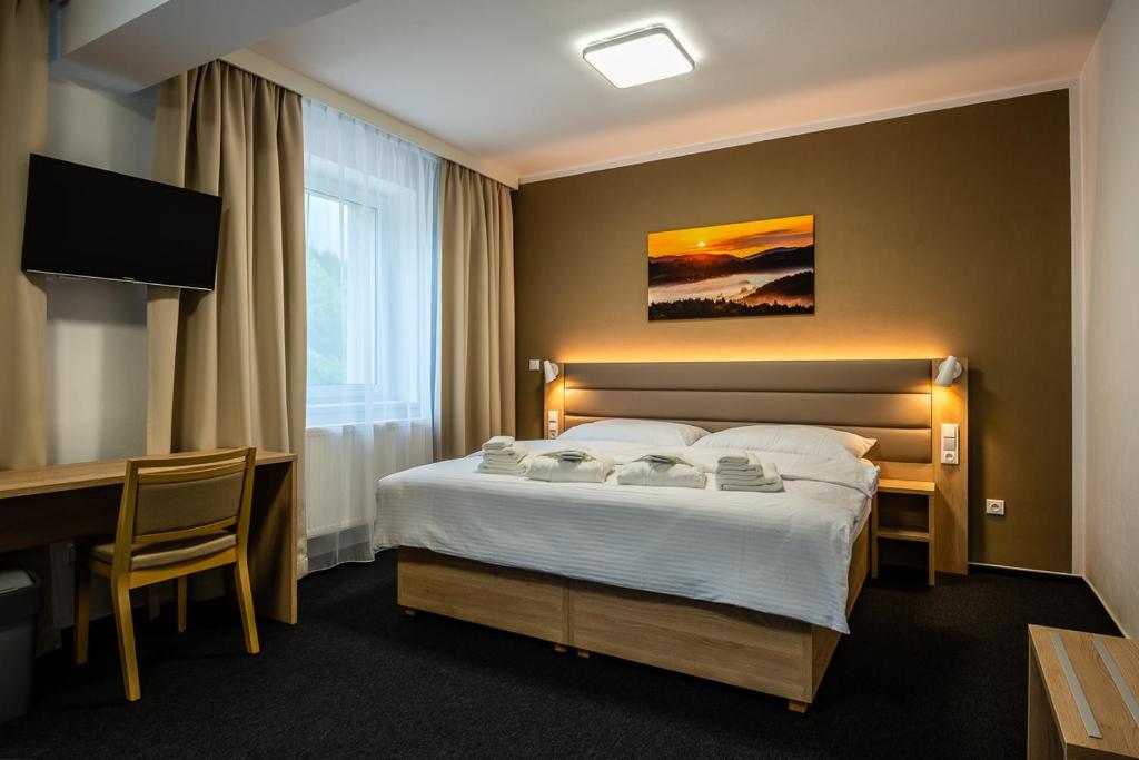 Postel nebo postele na pokoji v ubytování Penzion Čertovy skály