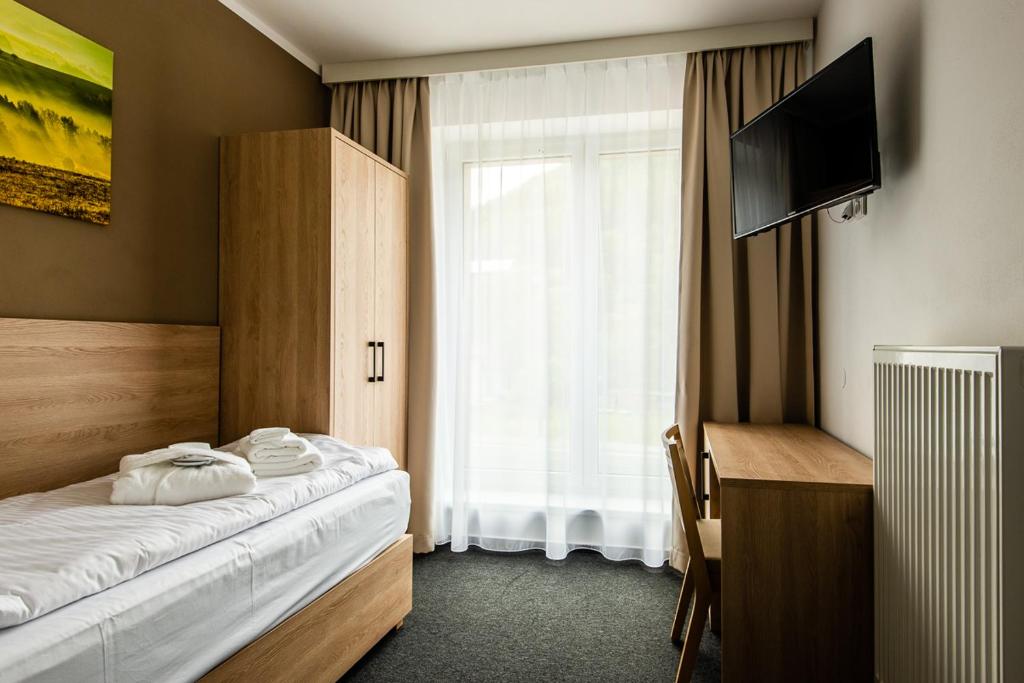 Postel nebo postele na pokoji v ubytování Penzion Čertovy skály