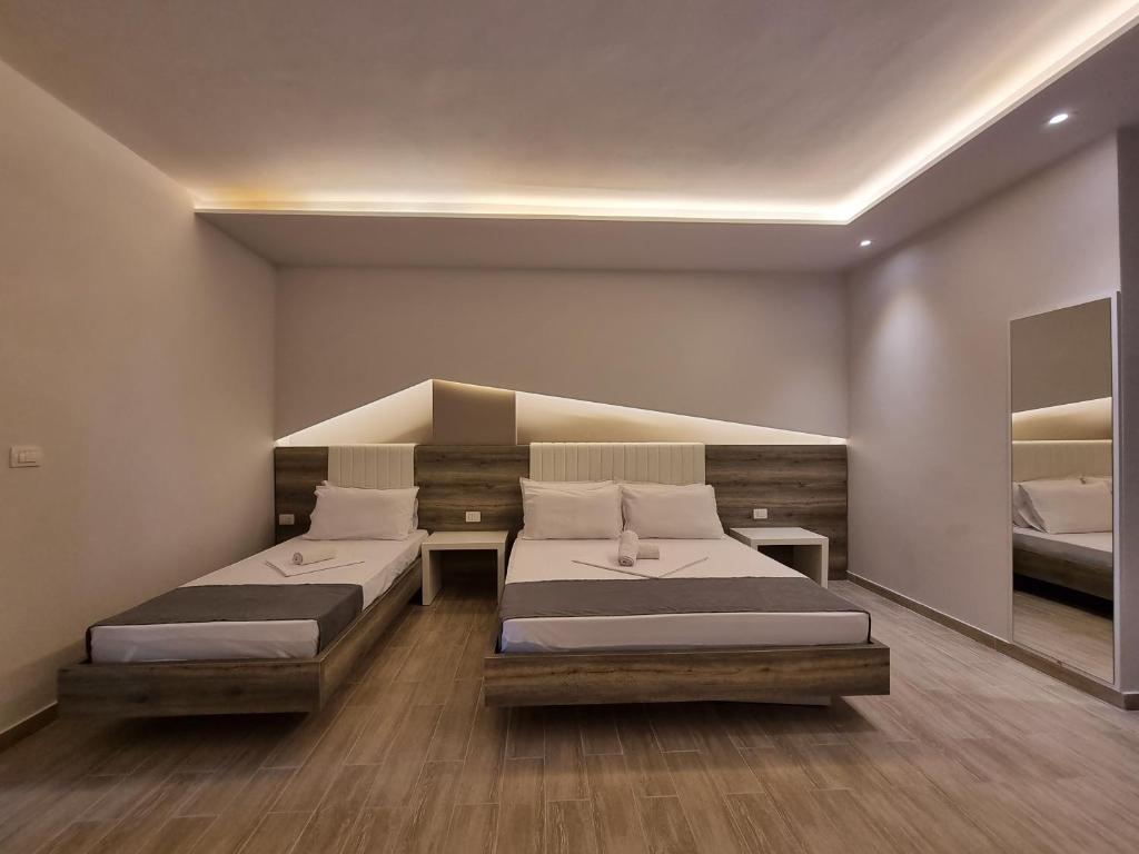 Кровать или кровати в номере Imperial Hotel