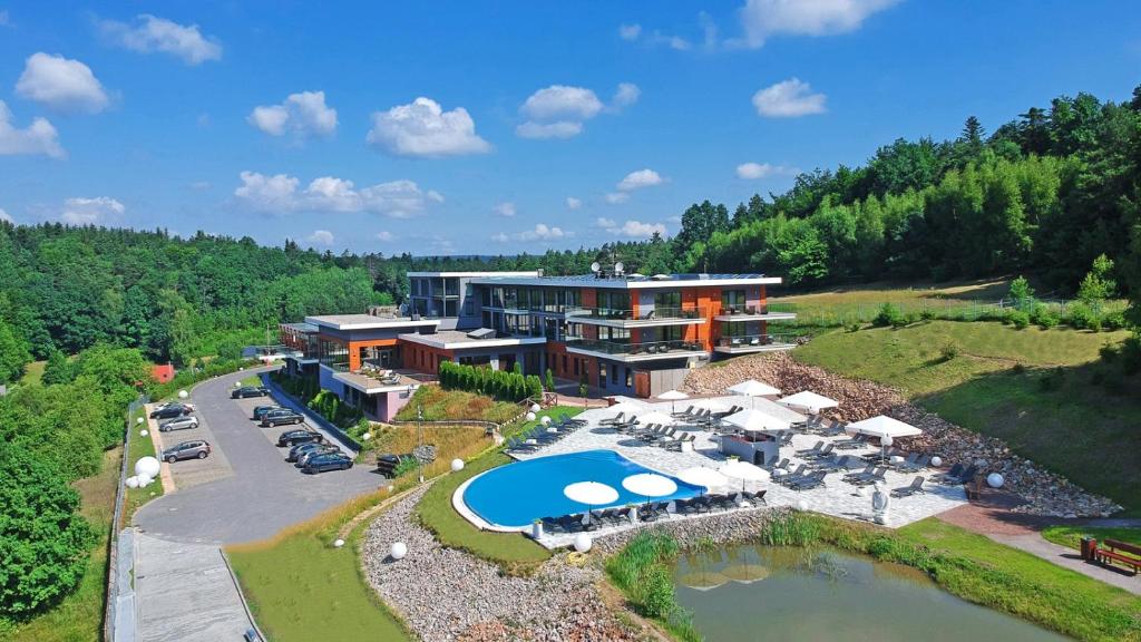 an aerial view of a resort with a pool at Odyssey ClubHotel Wellness&SPA in Kielce