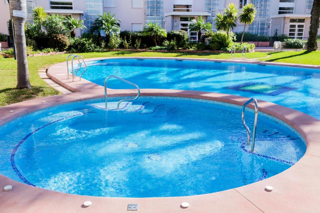 Bazén v ubytování Golden Gardens Saudade Apartment Javea Arenal by Rock Rentals nebo v jeho okolí