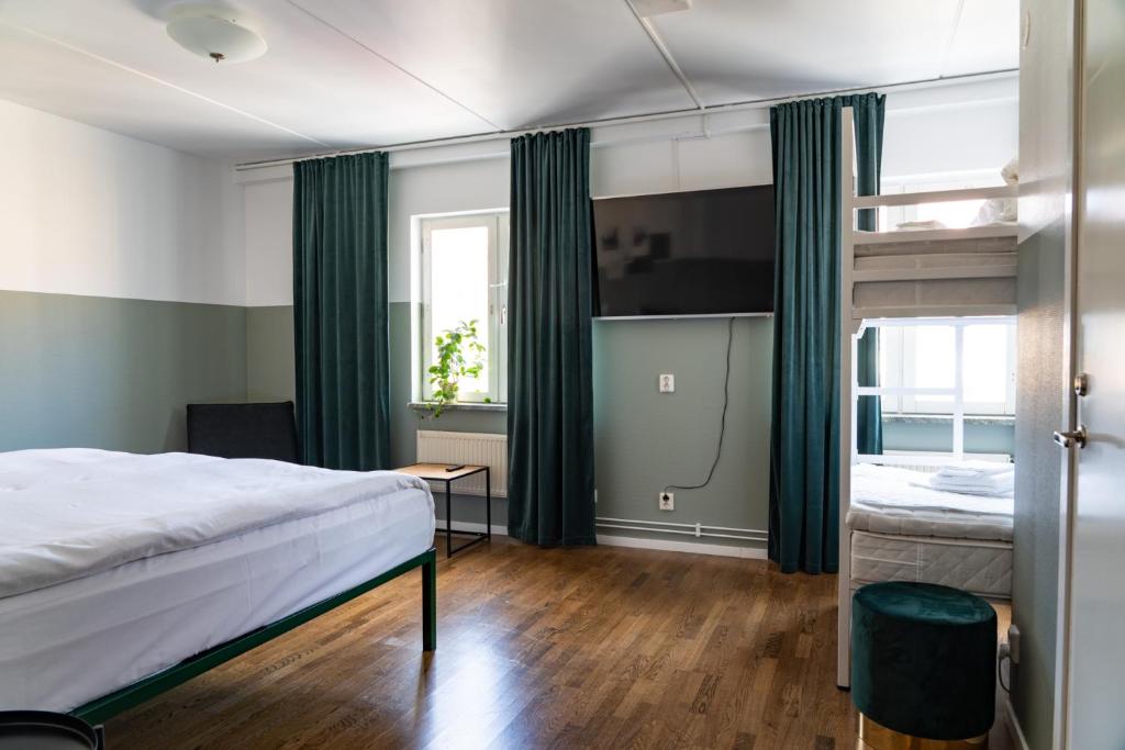 Postel nebo postele na pokoji v ubytování Botanika Uppsala