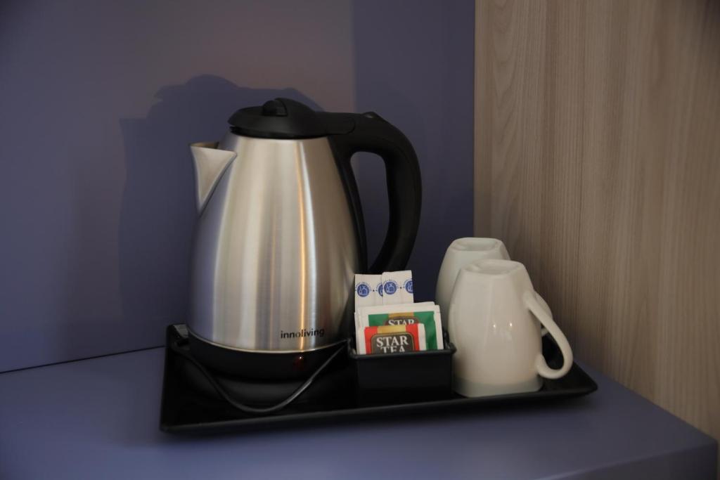 Príslušenstvo na prípravu kávy alebo čaju v ubytovaní Valenti rooms & relax
