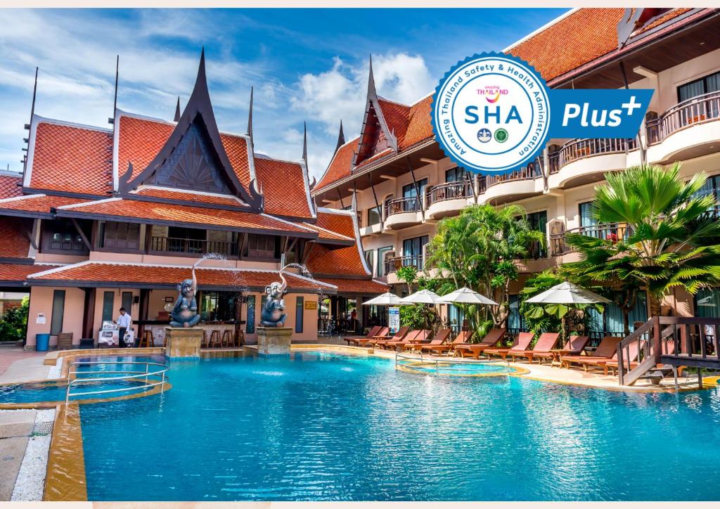 a swimming pool in front of a hotel at Nipa Resort, Patong Beach - SHA Extra Plus in Patong Beach