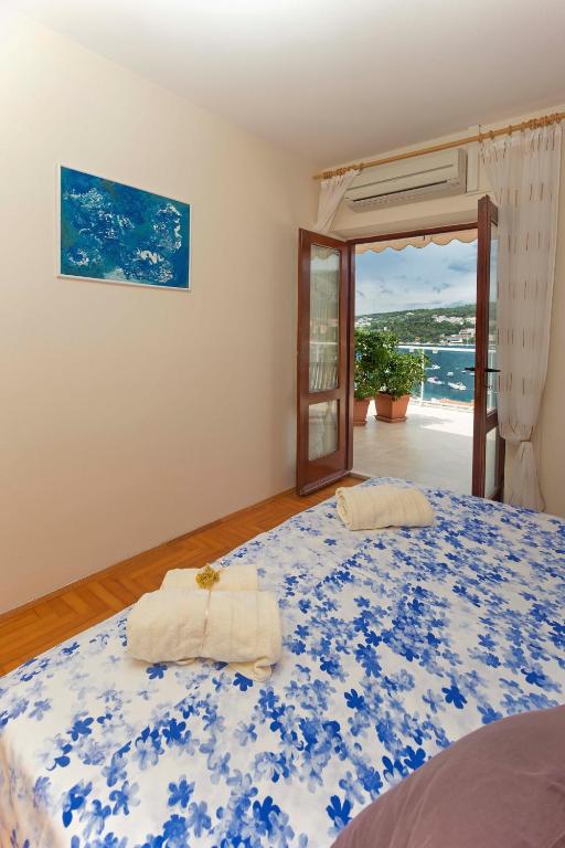 Postel nebo postele na pokoji v ubytování SeaView Guesthouse - ZF Hvar