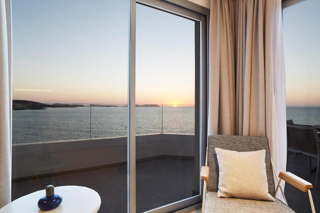 a room with a view of the ocean at Can Salia in San Antonio Bay