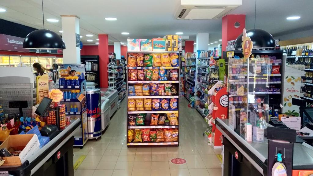 a store aisle of a grocery store with food at Rocha Brava Village Resort in Carvoeiro