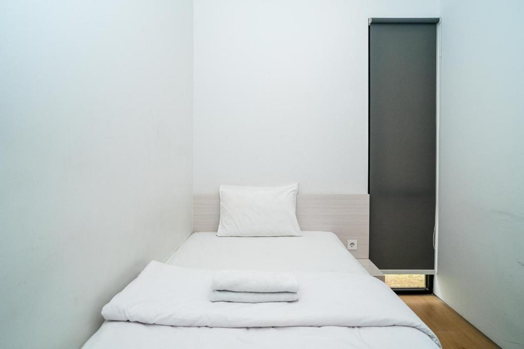Letto o letti in una camera di Three J Residence