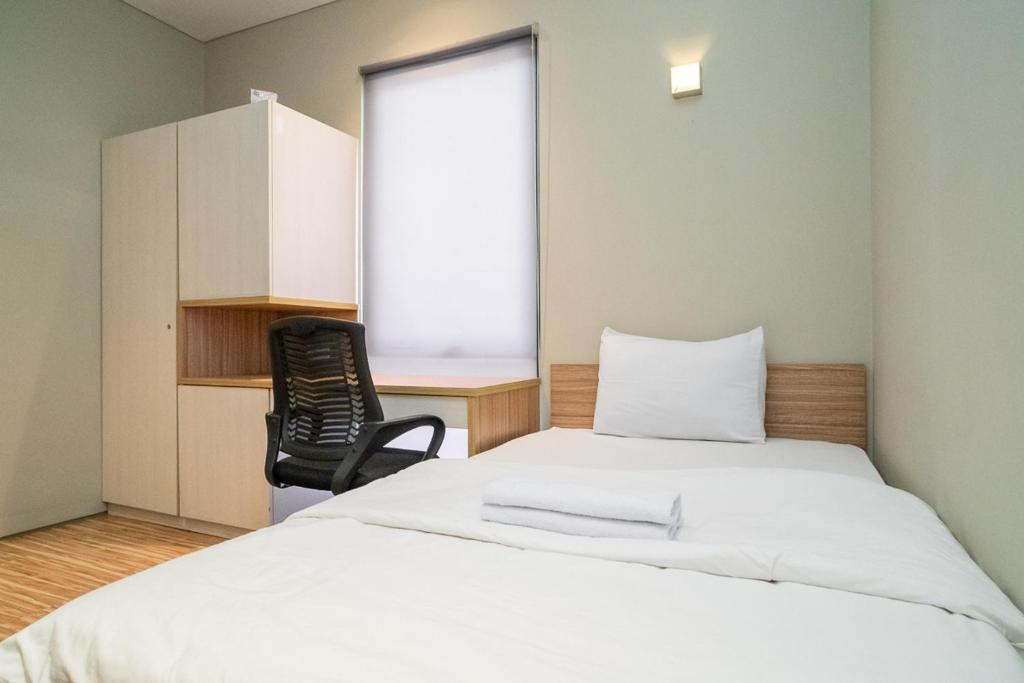 Letto o letti in una camera di Three J Residence