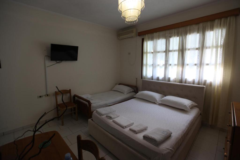 Postel nebo postele na pokoji v ubytování Vila Asidanu