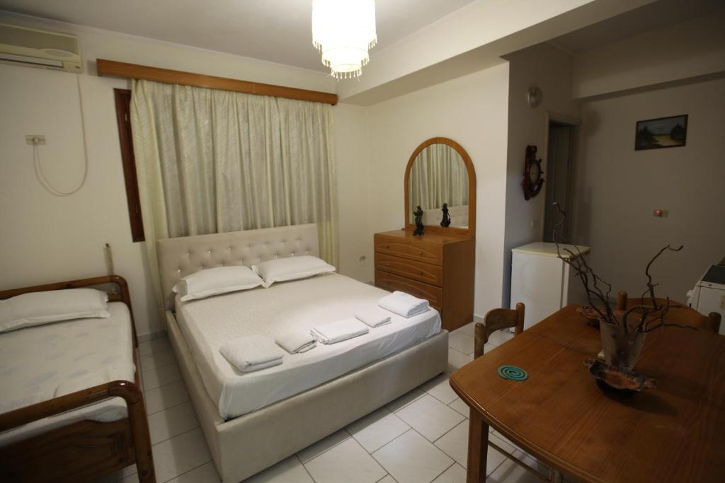 Postel nebo postele na pokoji v ubytování Vila Asidanu