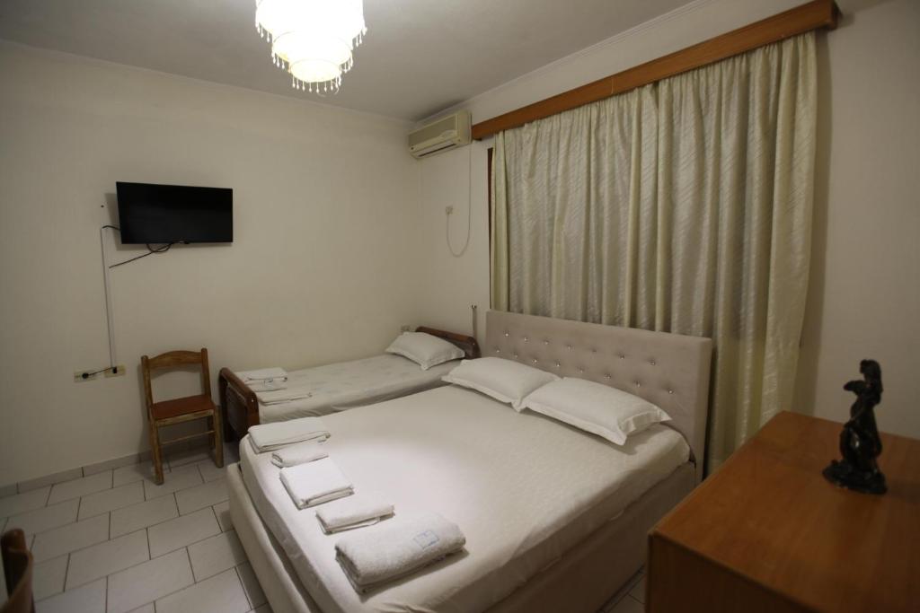Postel nebo postele na pokoji v ubytování Vila Asidanu