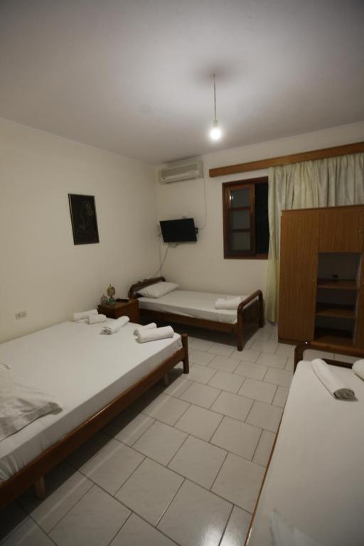Postel nebo postele na pokoji v ubytování Vila Asidanu