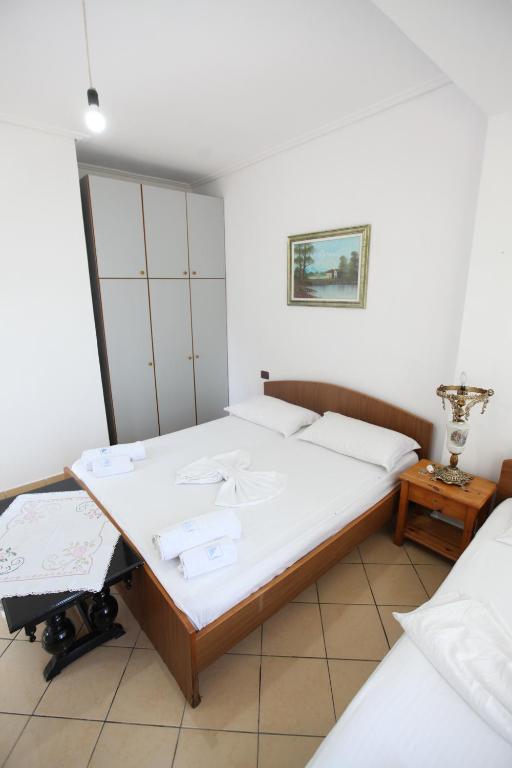 Postel nebo postele na pokoji v ubytování Vila Asidanu