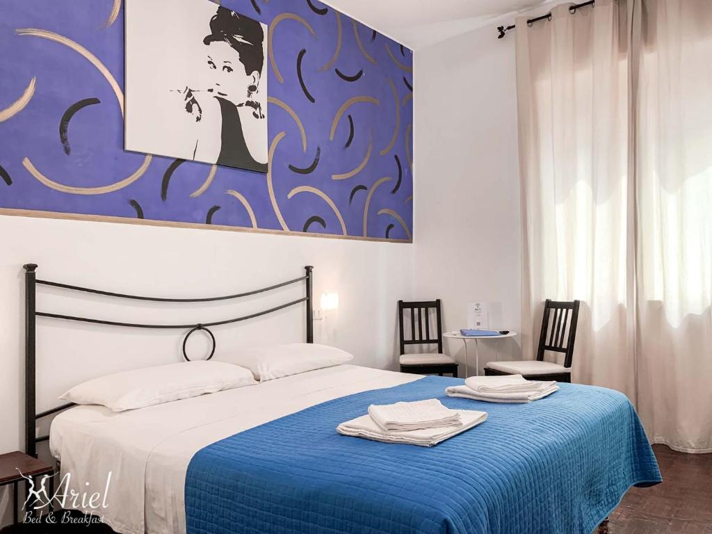 Postel nebo postele na pokoji v ubytování Ariel B&B
