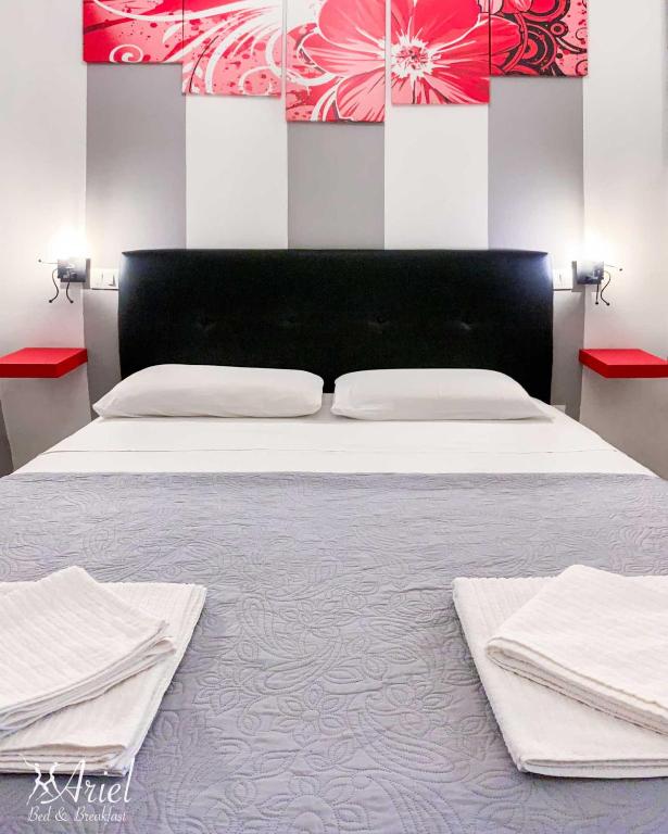 Postel nebo postele na pokoji v ubytování Ariel B&B