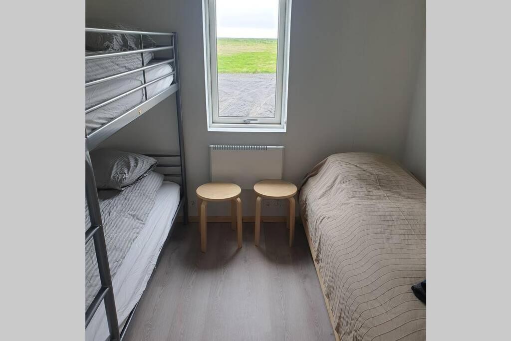 Postel nebo postele na pokoji v ubytování Árheimar 6 cosy holiday home