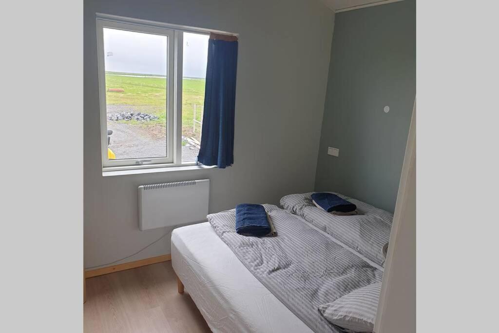 Postel nebo postele na pokoji v ubytování Árheimar 6 cosy holiday home