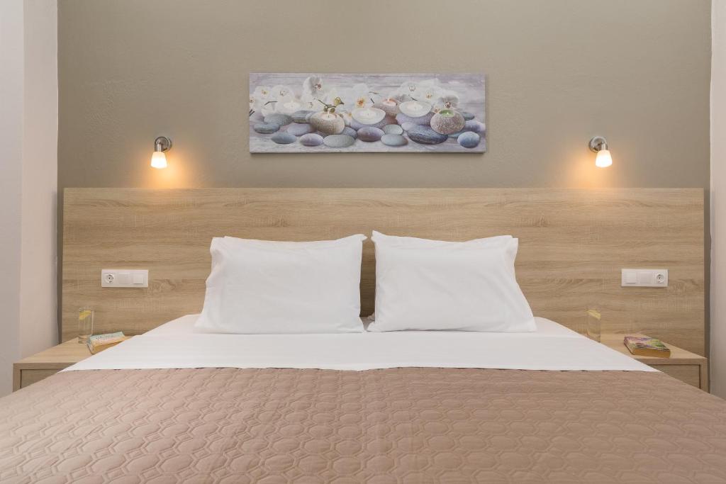 Voodi või voodid majutusasutuse Lefkimi Hotel toas