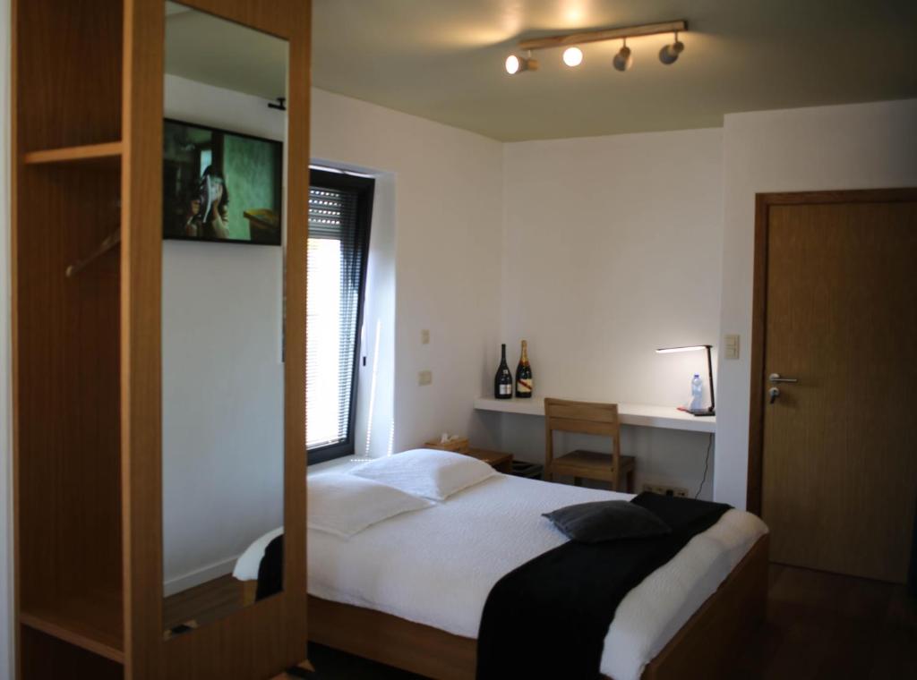 Postel nebo postele na pokoji v ubytování Hotel Gasthof Kapelhof