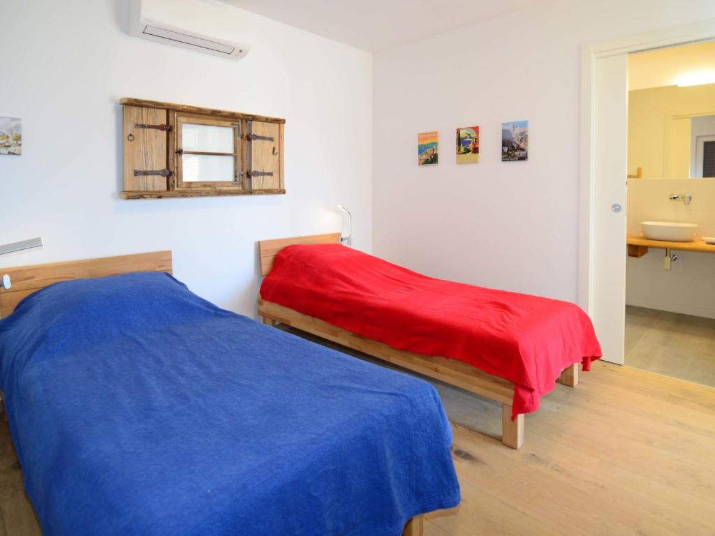 Postel nebo postele na pokoji v ubytování Apartment Viva-by the sea-garden & terraces by Interhome