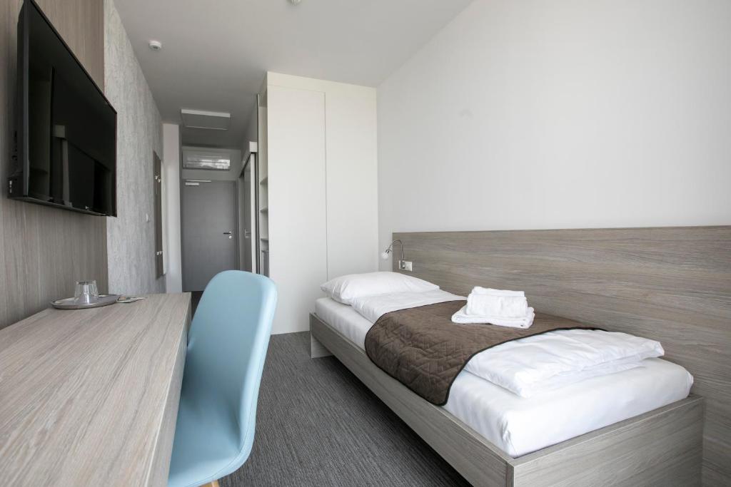Postel nebo postele na pokoji v ubytování Hotel HENDI CENTRUM