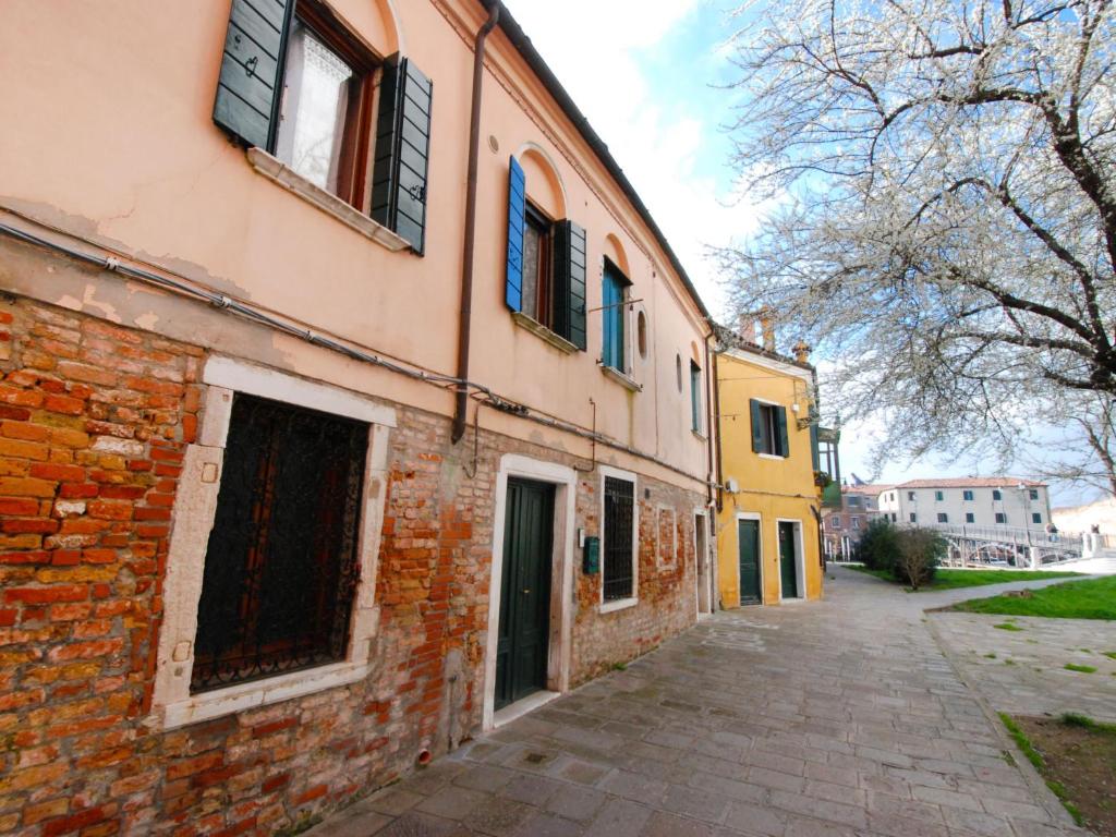 an old brick building with windows on a street at Apartment Valier by Interhome in Venice