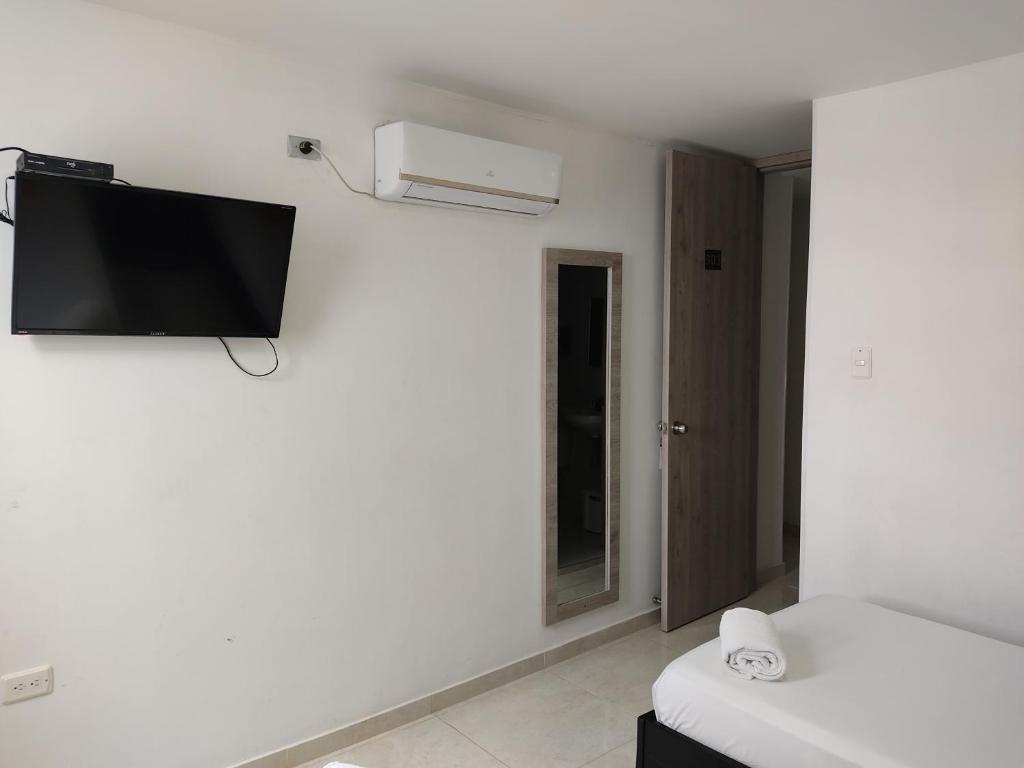TV a/nebo společenská místnost v ubytování HOTEL ESCALA GC Valledupar