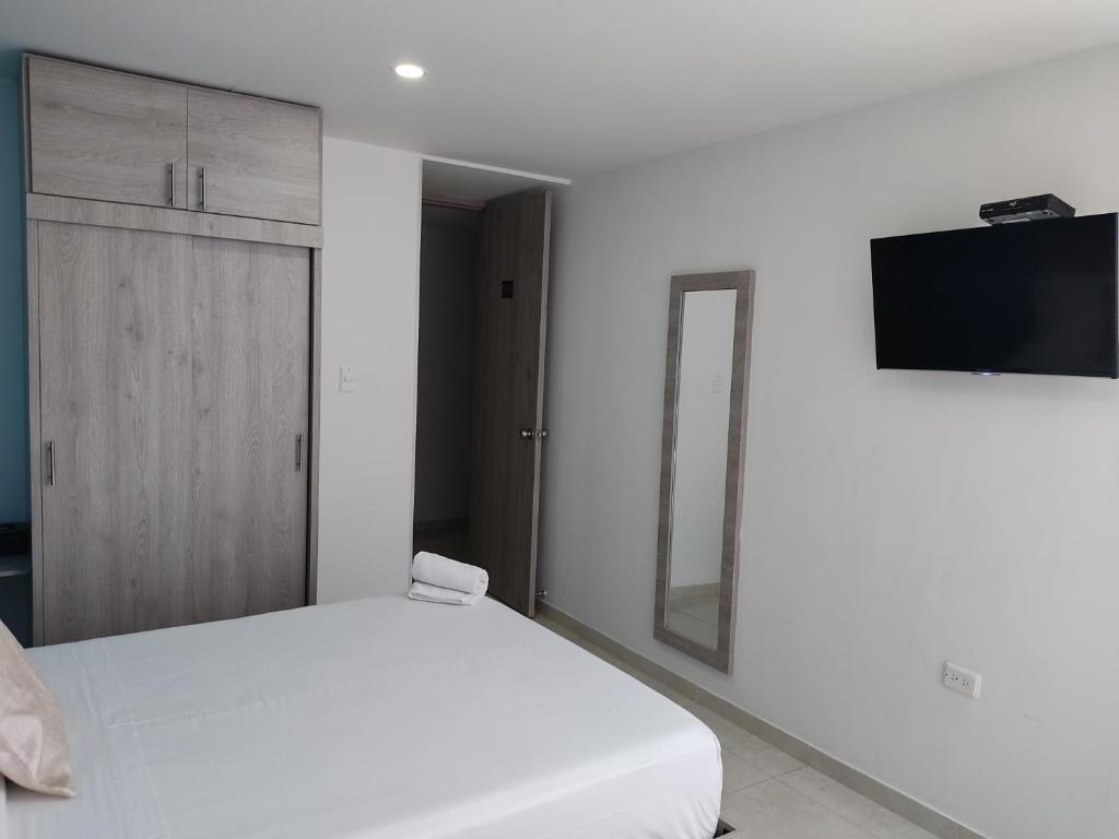 TV a/nebo společenská místnost v ubytování HOTEL ESCALA GC Valledupar