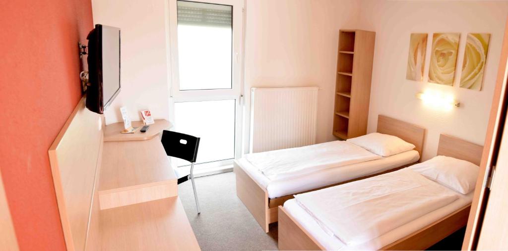Postel nebo postele na pokoji v ubytování Motel Angern
