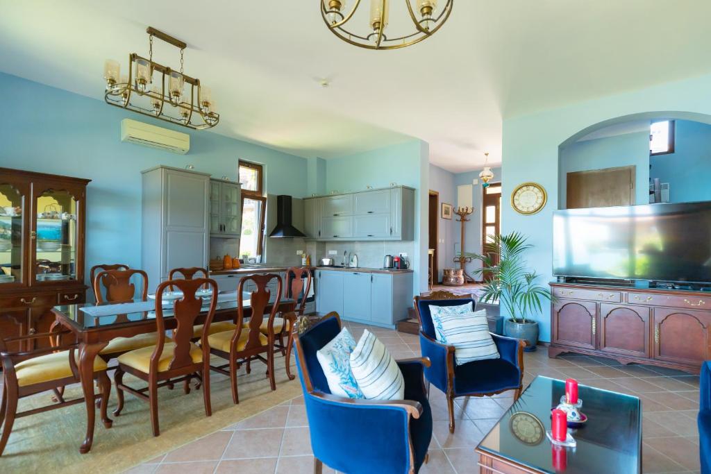 a kitchen and living room with a dining room at Luxury 3-bedroom villa in Sozopolis with sea view in Sozopol