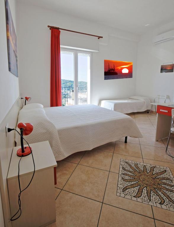 Postel nebo postele na pokoji v ubytování B&B Rose Villa