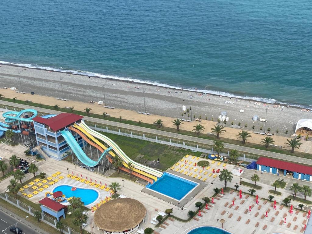 an aerial view of a water park on the beach at Orbi Sun&Sea Apartment in Batumi