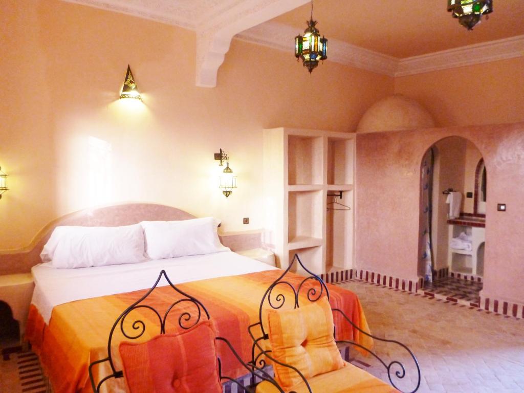 Postel nebo postele na pokoji v ubytování Auberge La Source