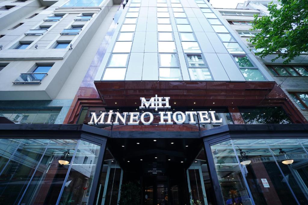 a hotel sign in front of a building at Mineo Hotel Taksim in Istanbul