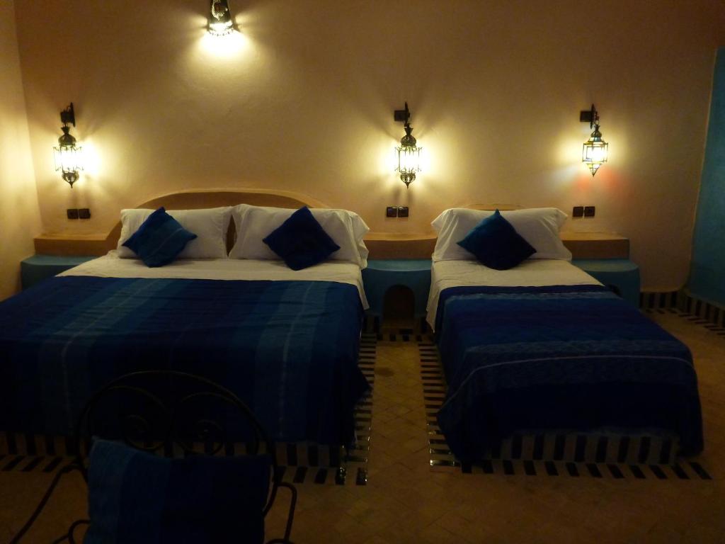 Postel nebo postele na pokoji v ubytování Auberge La Source