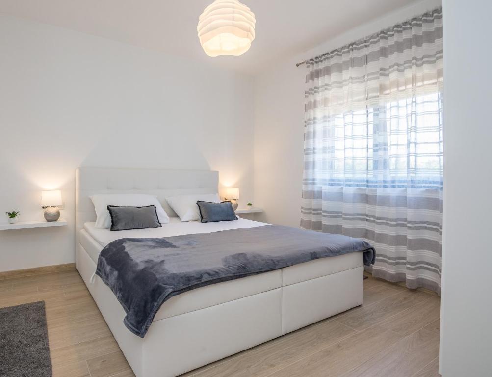 Posteľ alebo postele v izbe v ubytovaní Apartments Maella